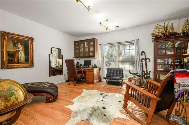 a bedroom with furniture and a window