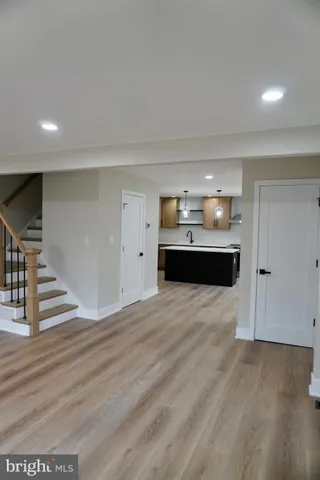 a view of kitchen with stainless steel appliances cabinets