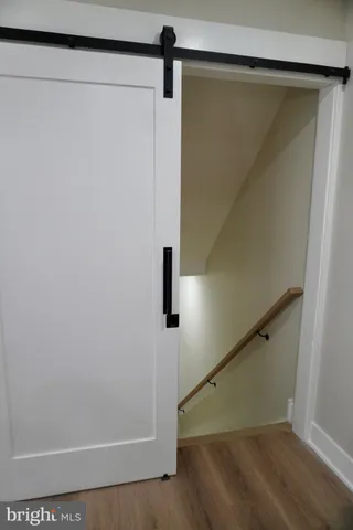 a white toilet sitting next to a shower