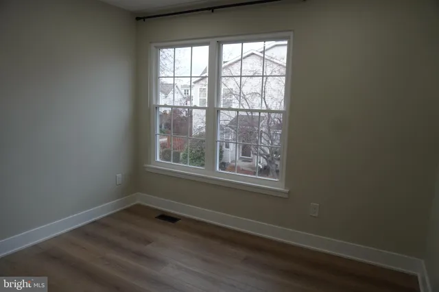 a bathroom with a sink vanity mirror and toilet