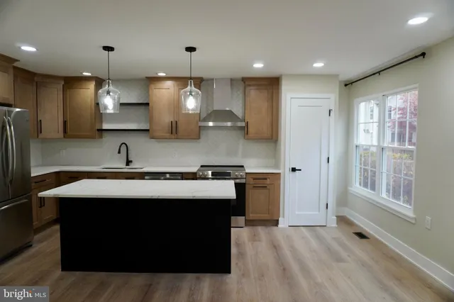 a kitchen with a stove and a sink