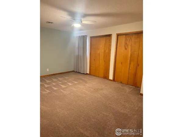 a view of an empty room with windows