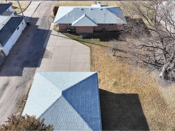 a aerial view of a house with a yard