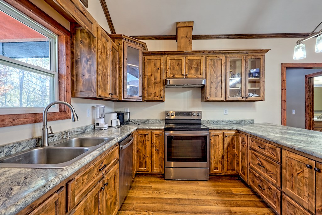 87 Mason Lane Marble, NC 28905 - Photo 12 of 66 a kitchen with stainless steel appliances granite countertop a sink stove and cabinets