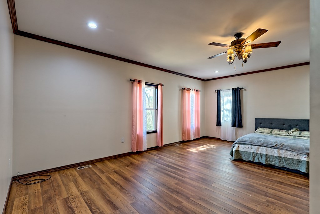 87 Mason Lane Marble, NC 28905 - Photo 25 of 66 a living room with furniture and a chandelier