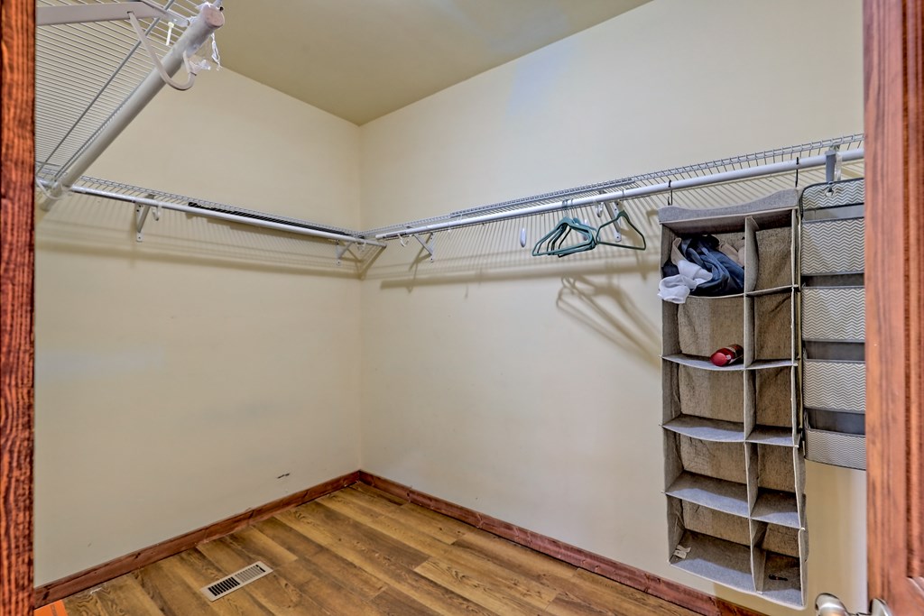 87 Mason Lane Marble, NC 28905 - Photo 29 of 66 a view of walk in closet with empty racks