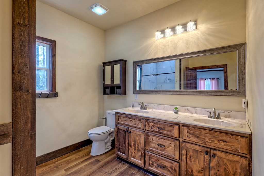 87 Mason Lane Marble, NC 28905 - Photo 30 of 66 a bathroom with a double vanity sink and a toilet