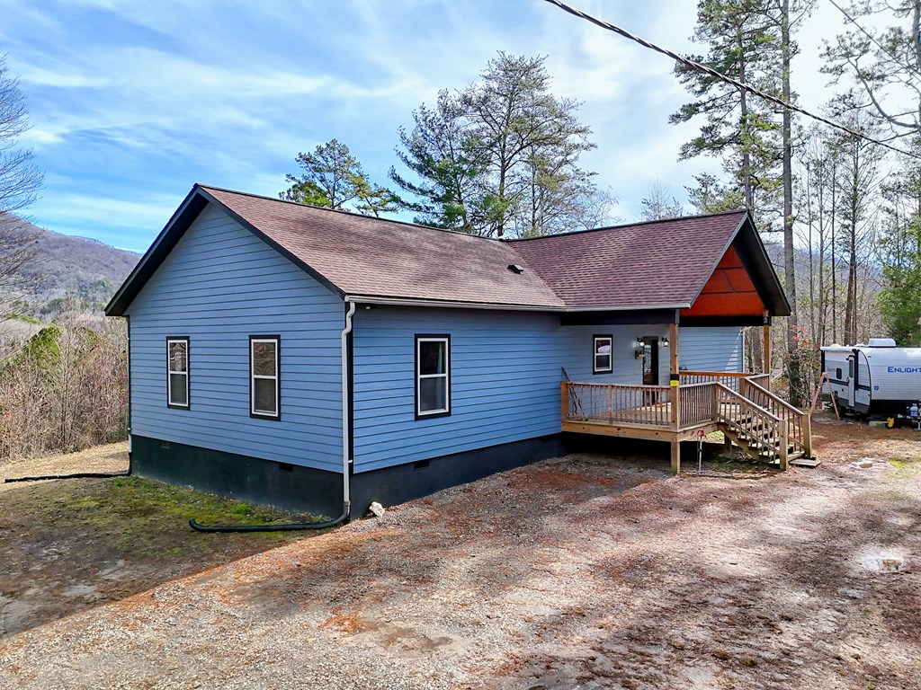 87 Mason Lane Marble, NC 28905 - Photo 3 of 66 a view of a house with a yard and wooden fence
