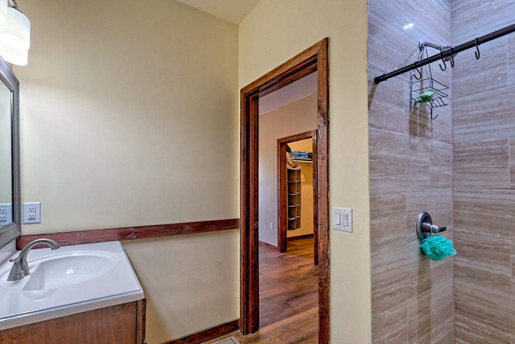 87 Mason Lane Marble, NC 28905 - Photo 45 of 66 a bathroom with a sink and a mirror