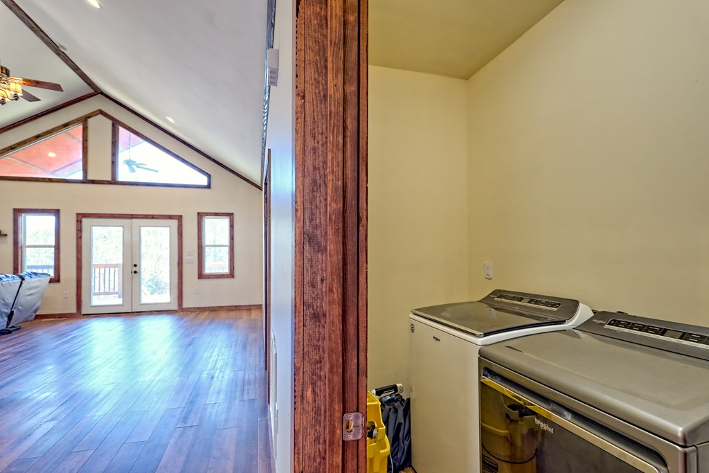 87 Mason Lane Marble, NC 28905 - Photo 56 of 66 a view of a hallway with wooden floor and staircase