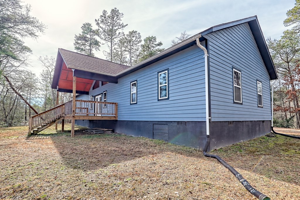 87 Mason Lane Marble, NC 28905 - Photo 63 of 66 a view of a house with a yard and wooden fence
