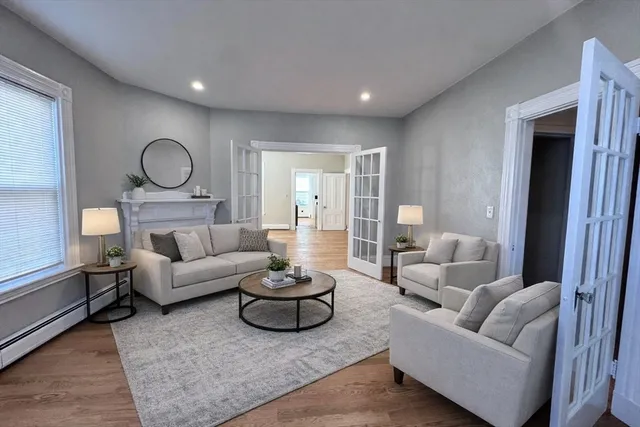a living room with furniture and a large window
