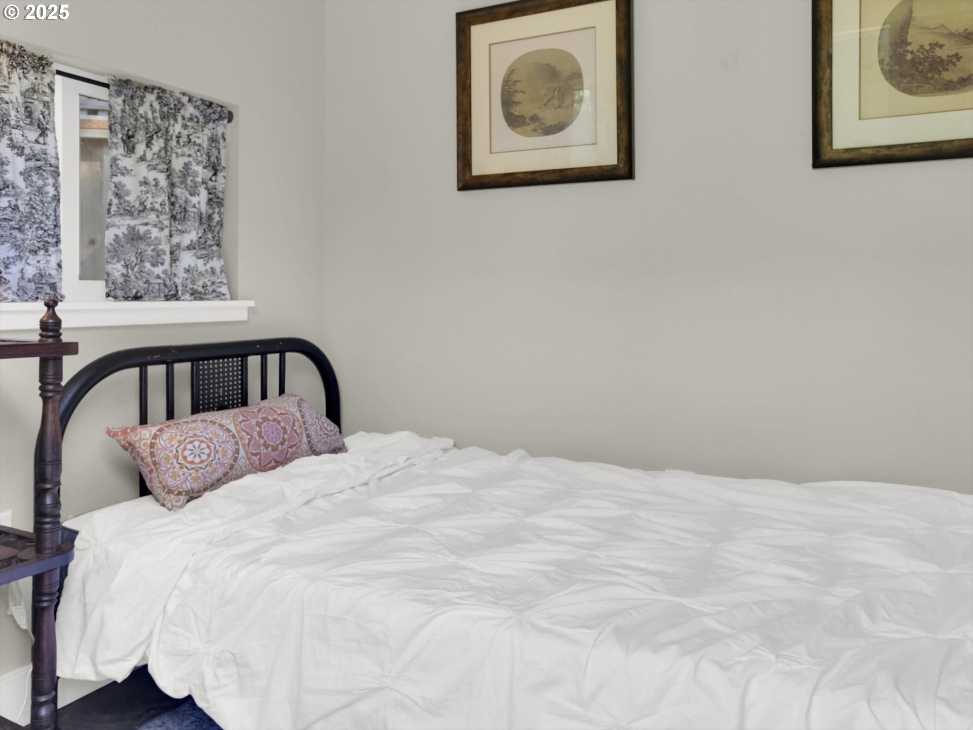 2518 Southeast Elliott Drive Gresham, OR 97080 - Photo 40 of 48 a bedroom with a bed and a painting on the wall