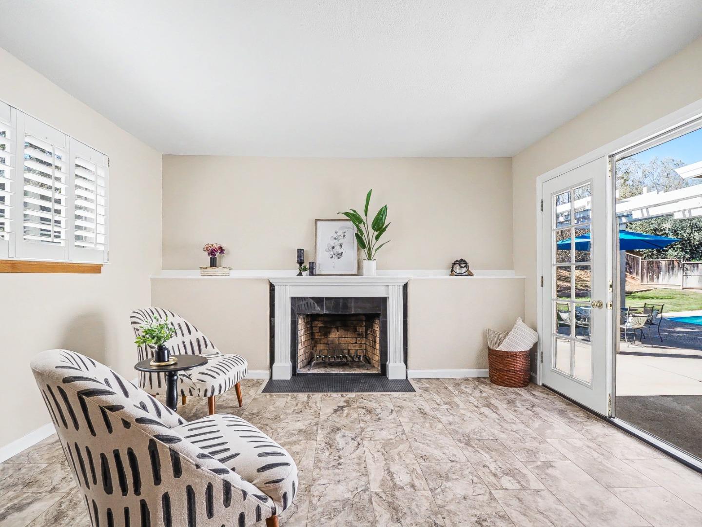 6455 Kensington Place Gilroy, CA 95020 - Photo 14 of 32 a living room with furniture and a fireplace