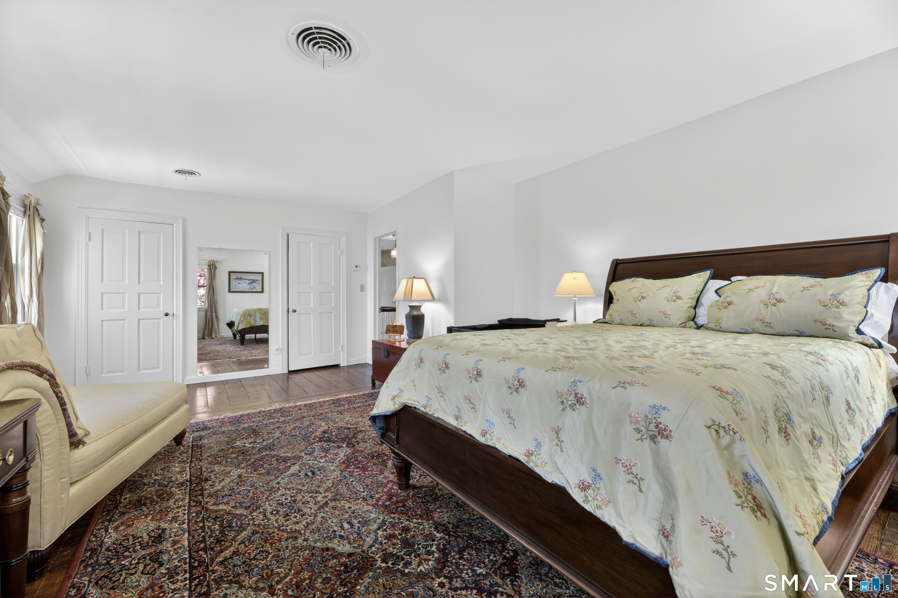 32 Money Point Road Stonington, CT 06355 - Photo 25 of 40 a spacious bedroom with a bed a couch and a window