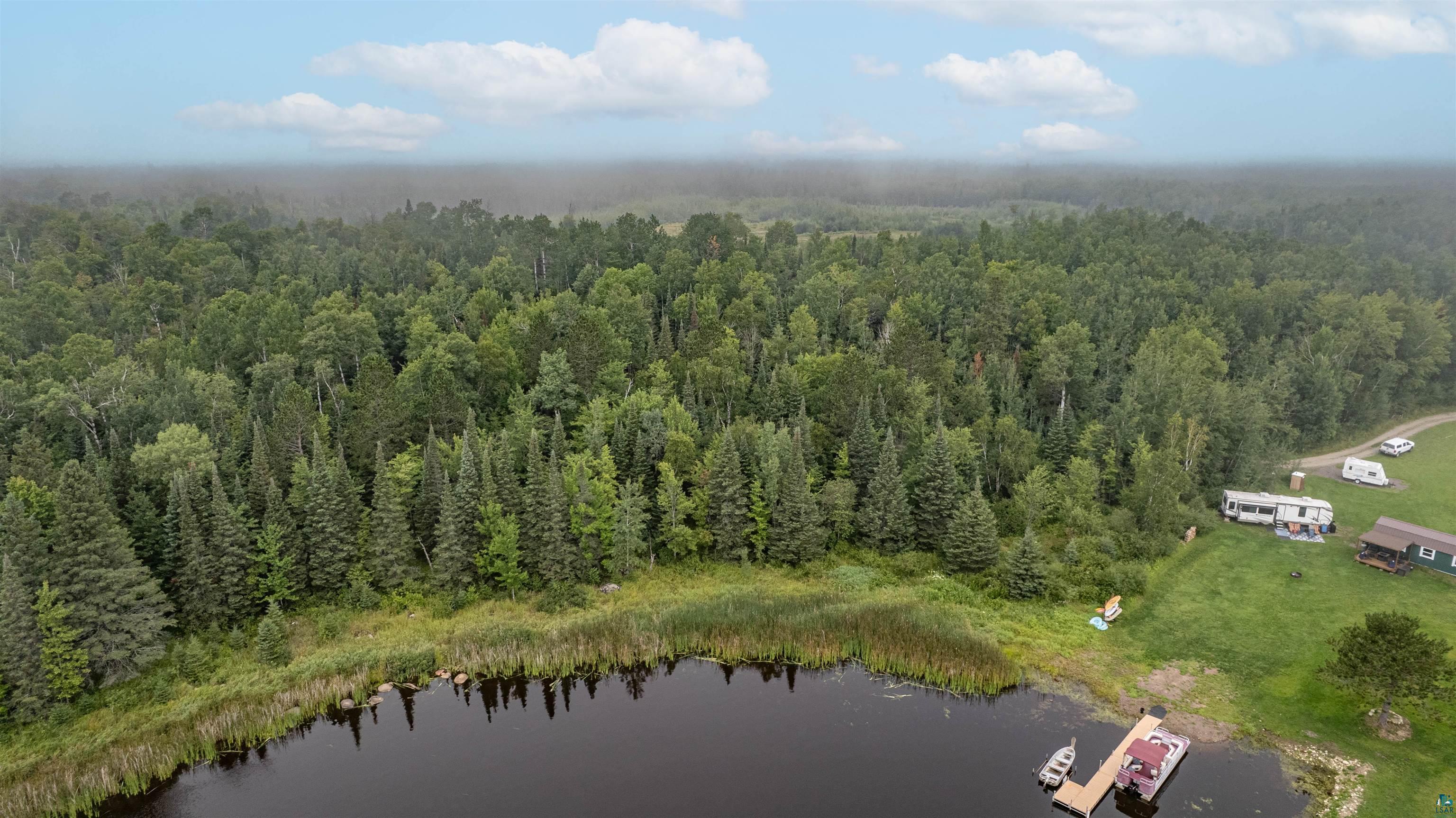 4-xxx Toivonen Road Makinen, MN 55763 - Photo 2 of 9 Drone / aerial view of a nearby body of water and a forest