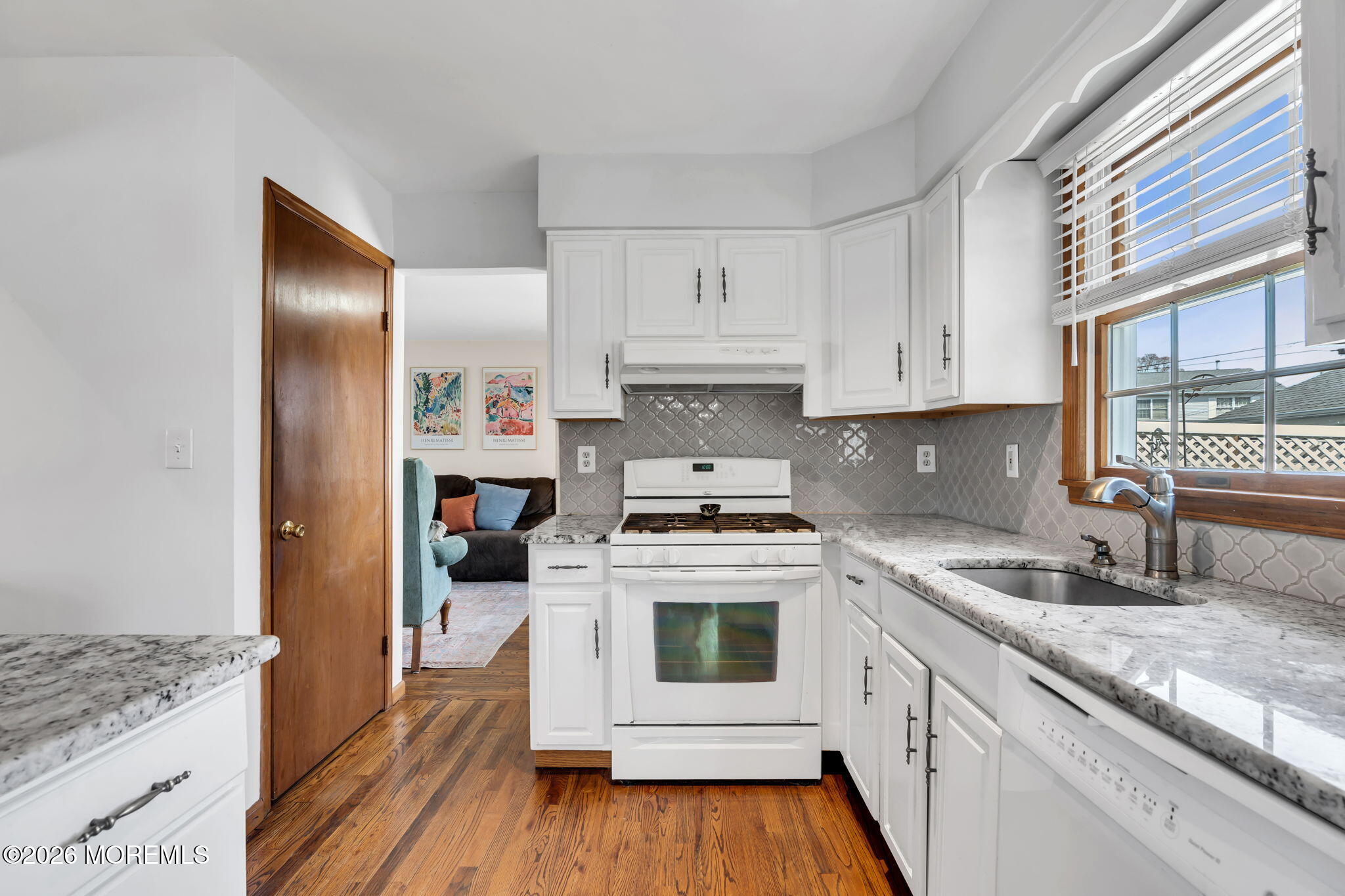1706 Bay Avenue Point Pleasant, NJ 08742 - Photo 11 of 34 a kitchen with a stove a sink and a refrigerator