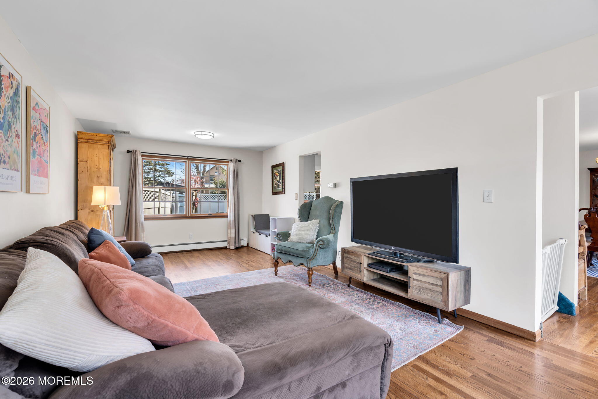 1706 Bay Avenue Point Pleasant, NJ 08742 - Photo 13 of 34 a living room with furniture and a flat screen tv