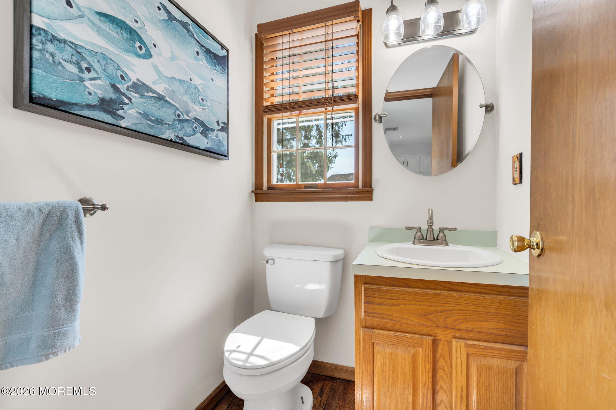 1706 Bay Avenue Point Pleasant, NJ 08742 - Photo 15 of 34 a bathroom with a granite countertop toilet a sink and a mirror