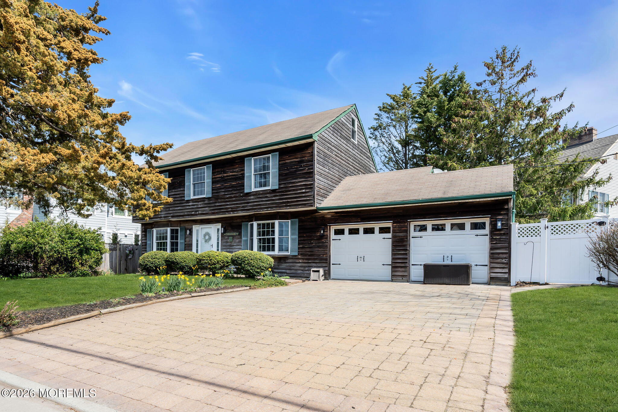 1706 Bay Avenue Point Pleasant, NJ 08742 - Photo 4 of 34 a front view of a house with a garden