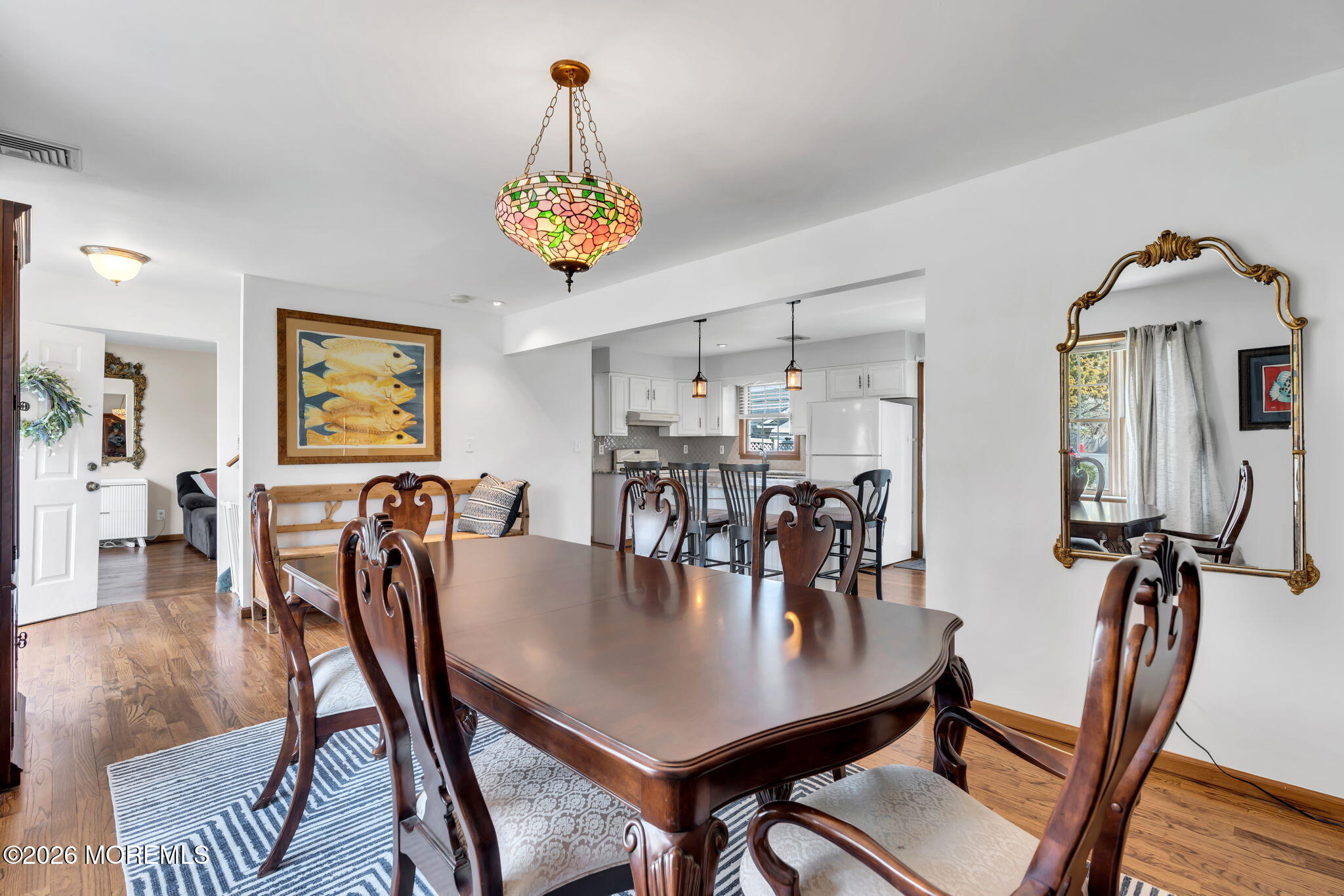 1706 Bay Avenue Point Pleasant, NJ 08742 - Photo 8 of 34 a view of a dining room with furniture and chandelier