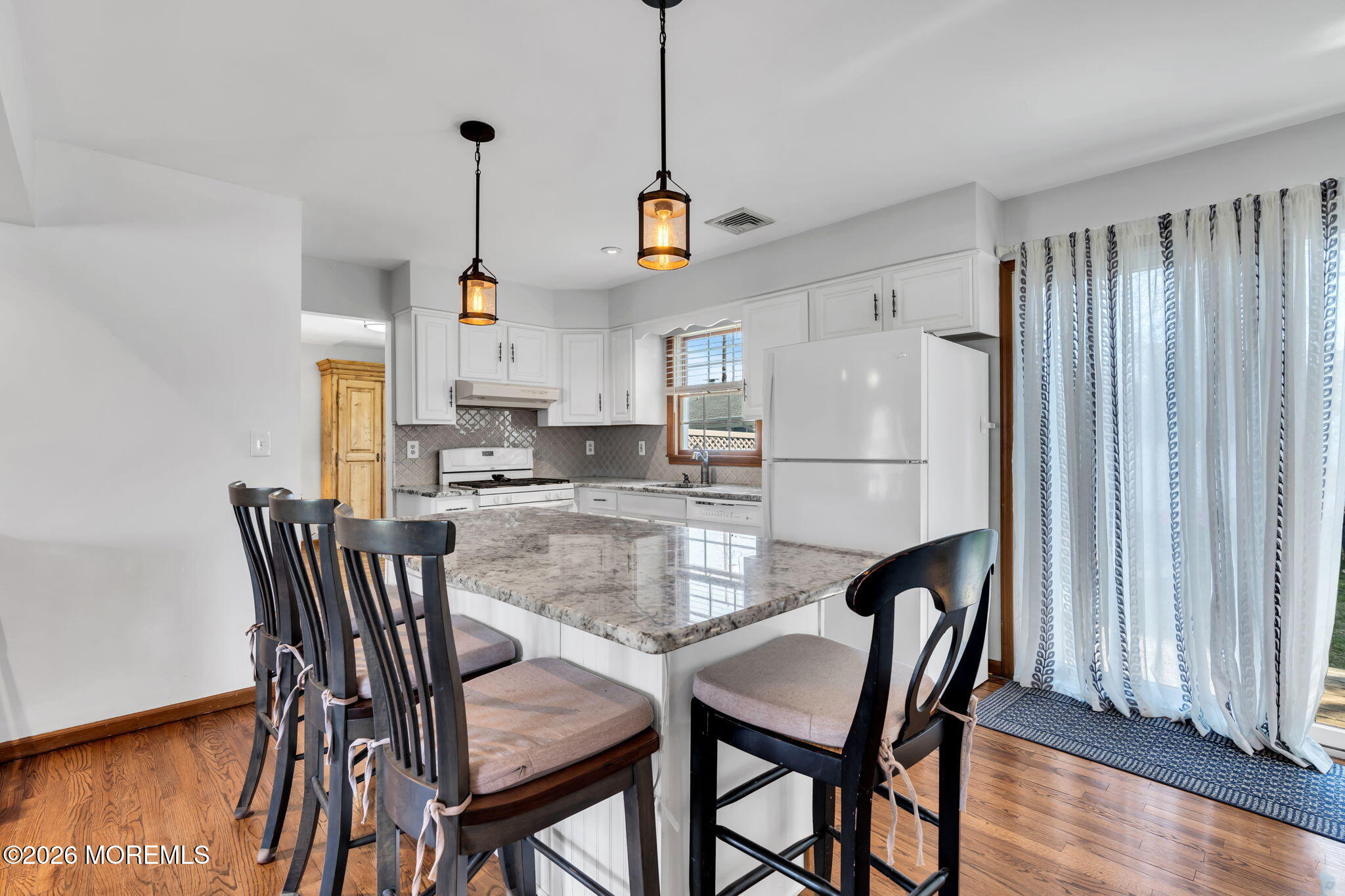 1706 Bay Avenue Point Pleasant, NJ 08742 - Photo 9 of 34 a view of kitchen with dining table and chairs