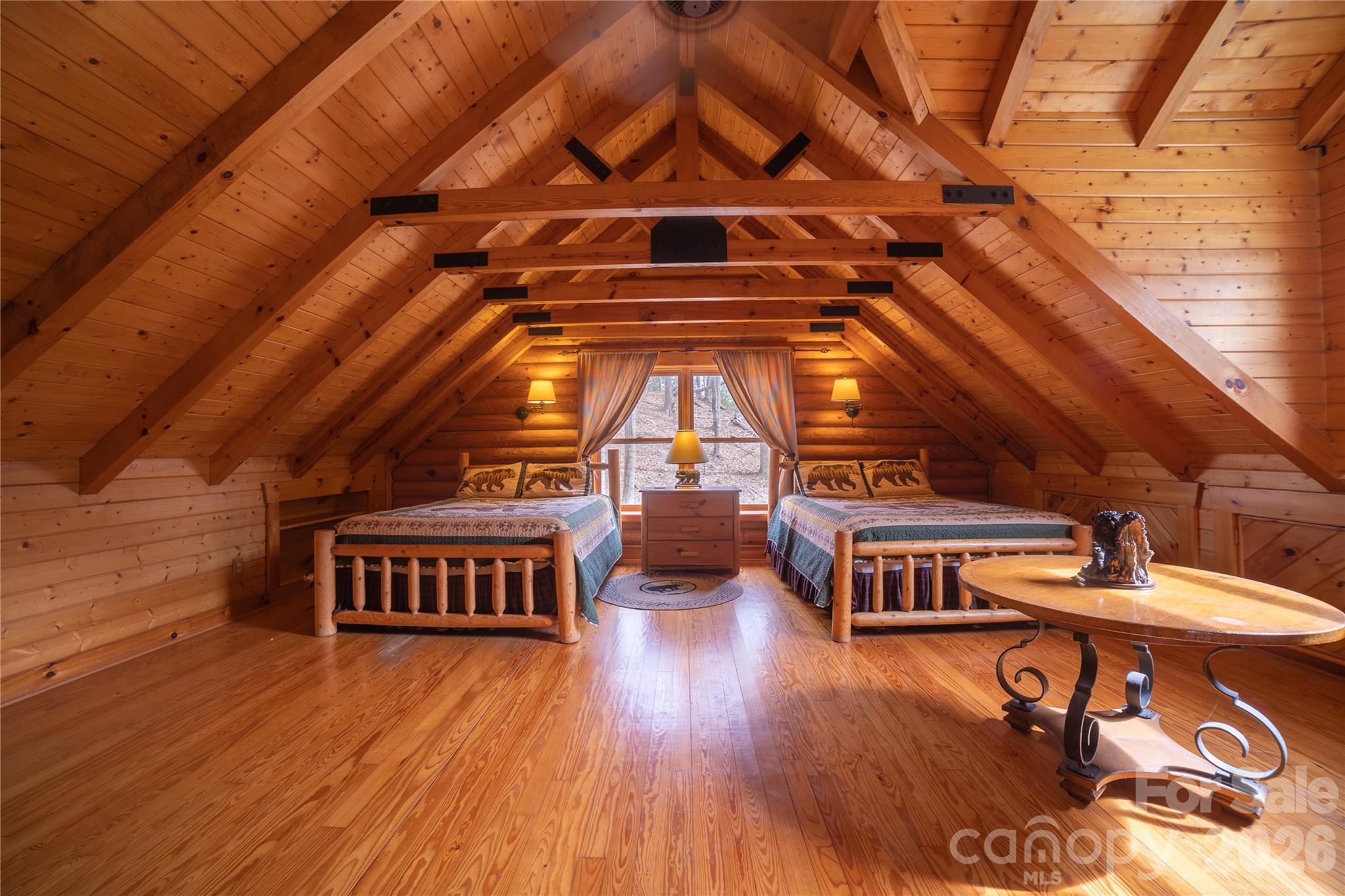 682 Rock House Road Hot Springs, NC 28743 - Photo 21 of 43 a living room with lots of furniture and a wooden floor