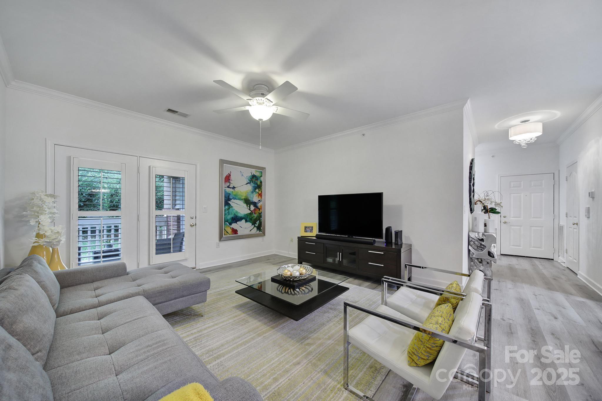 12355 Copper Mountain Boulevard Charlotte, NC 28277 - Photo 16 of 33 a living room with furniture and a flat screen tv