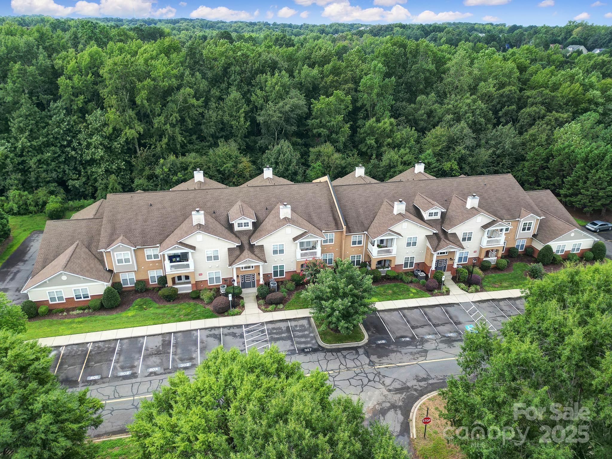 12355 Copper Mountain Boulevard Charlotte, NC 28277 - Photo 2 of 33 an aerial view of residential houses with outdoor space and trees all around