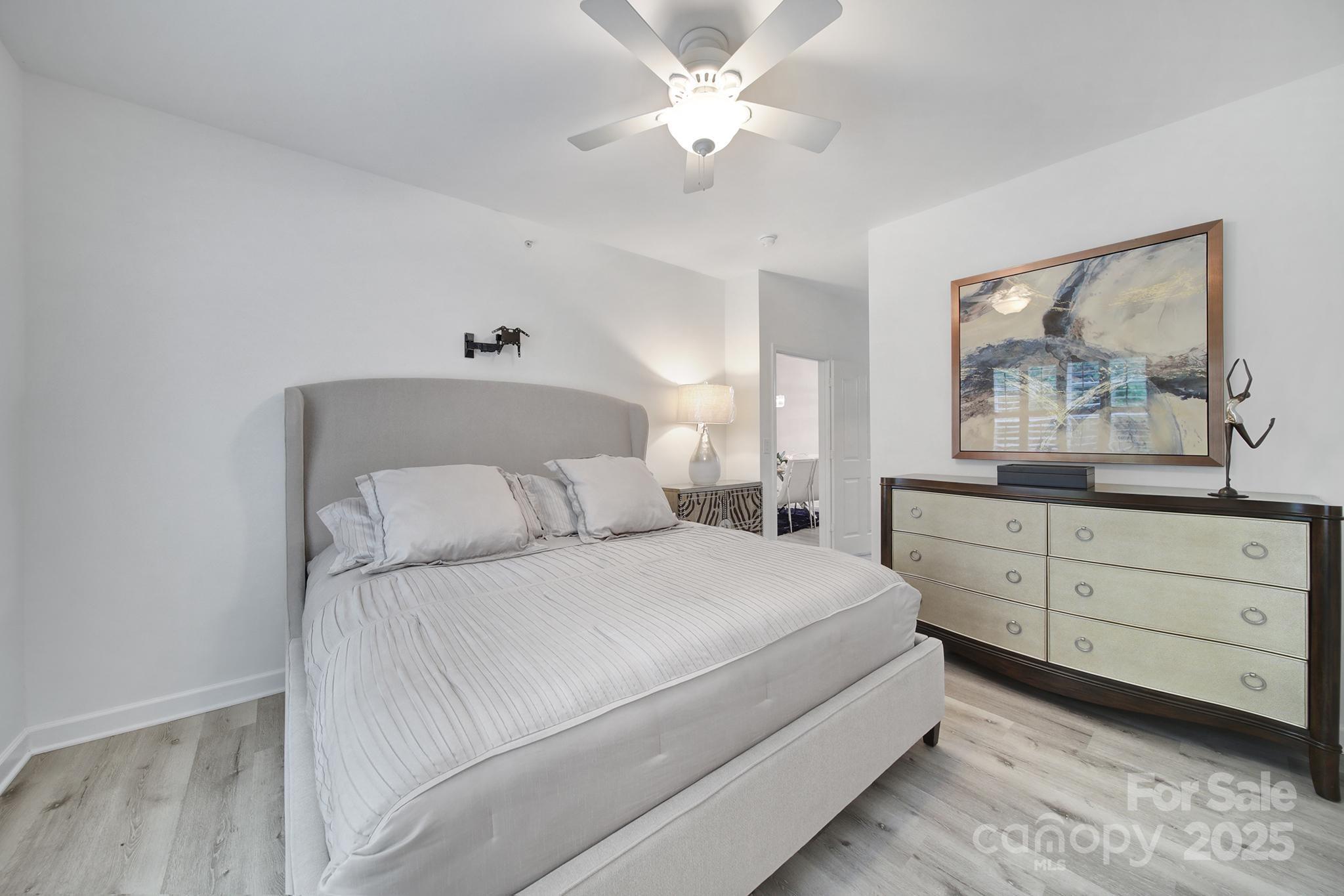 12355 Copper Mountain Boulevard Charlotte, NC 28277 - Photo 25 of 33 a bedroom with a bed and a chandelier