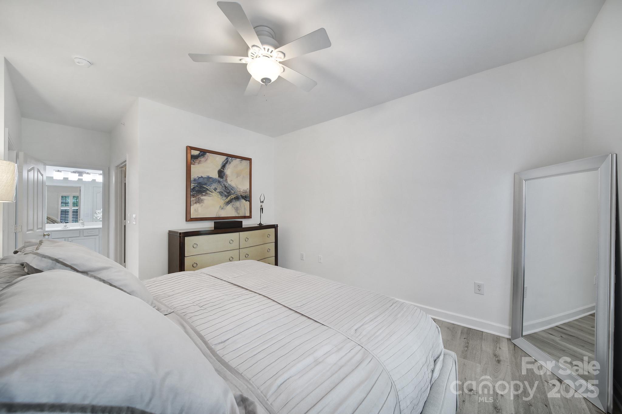 12355 Copper Mountain Boulevard Charlotte, NC 28277 - Photo 26 of 33 a bedroom with a large bed and a chandelier
