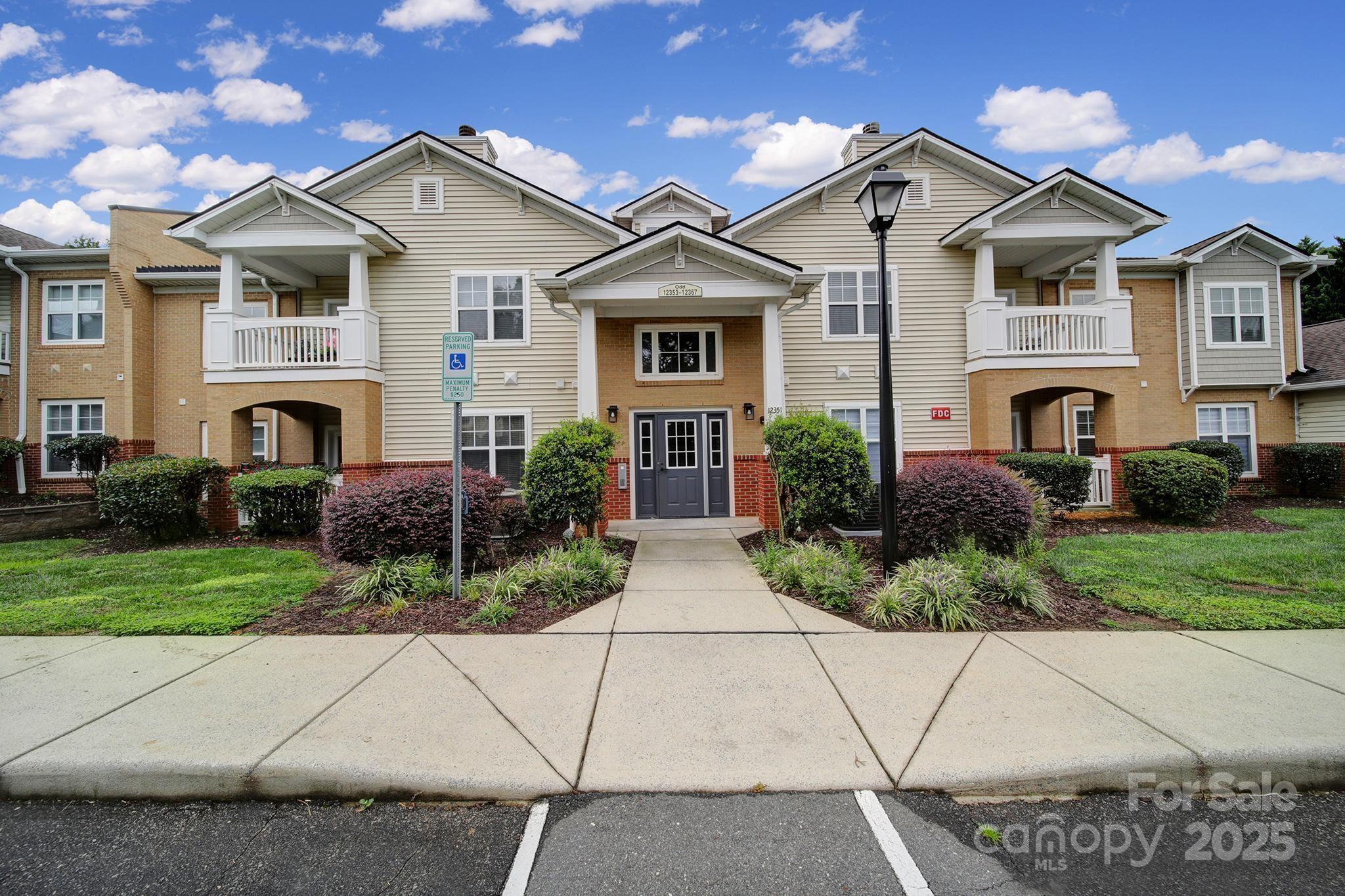 12355 Copper Mountain Boulevard Charlotte, NC 28277 - Photo 31 of 33 a front view of a house with a garden