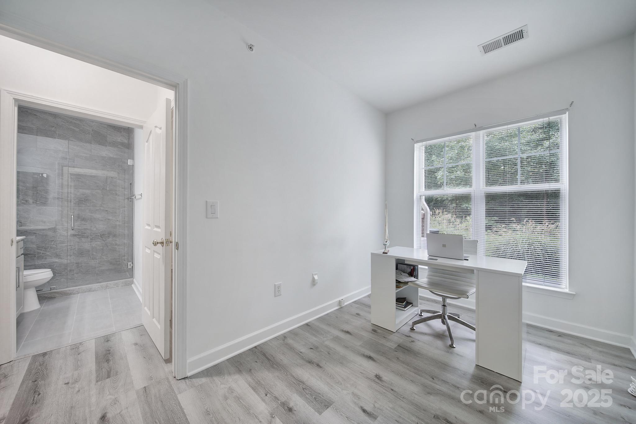 12355 Copper Mountain Boulevard Charlotte, NC 28277 - Photo 8 of 33 a view of a room with a bench and a window