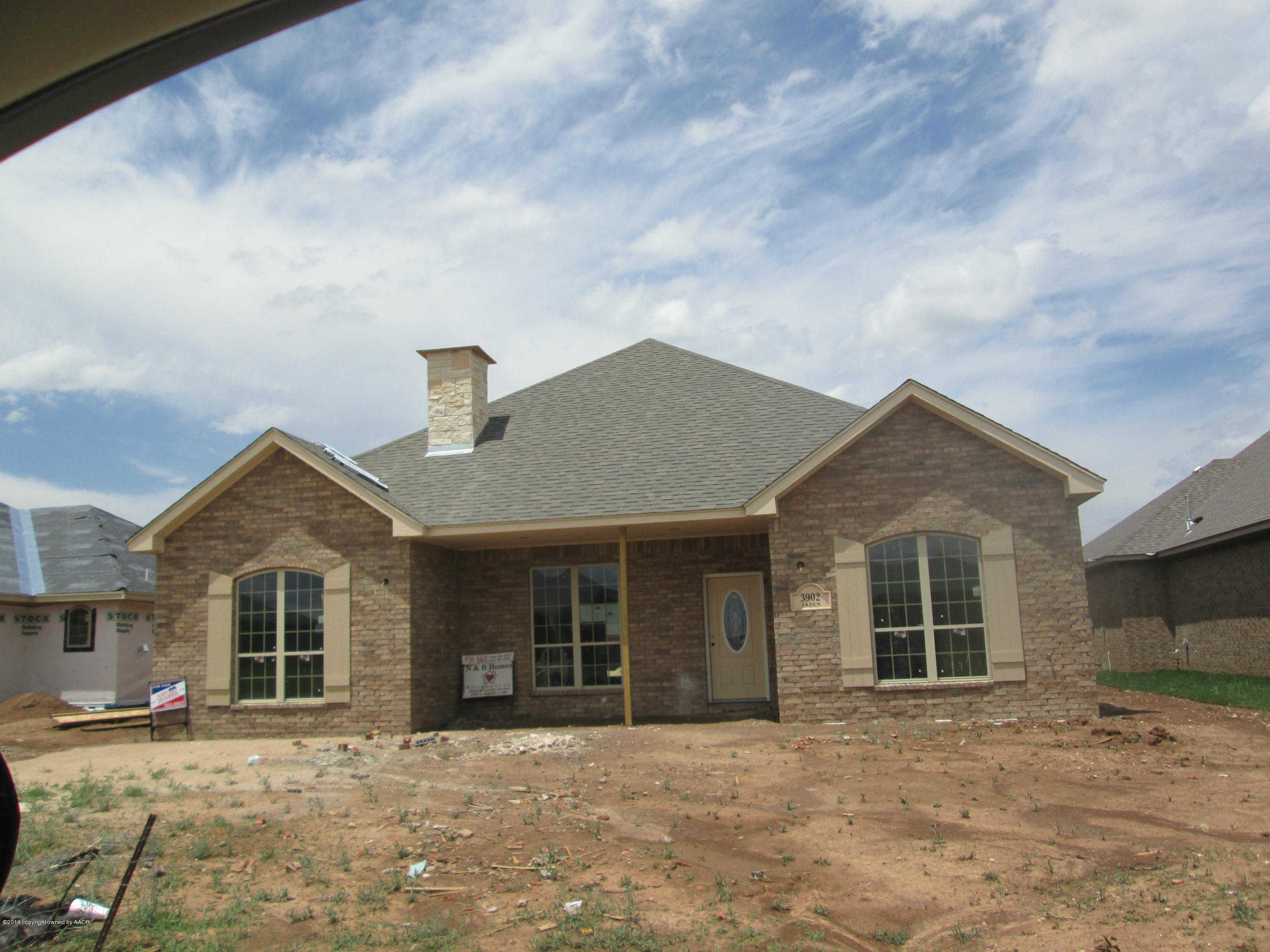 a front view of a house with yard