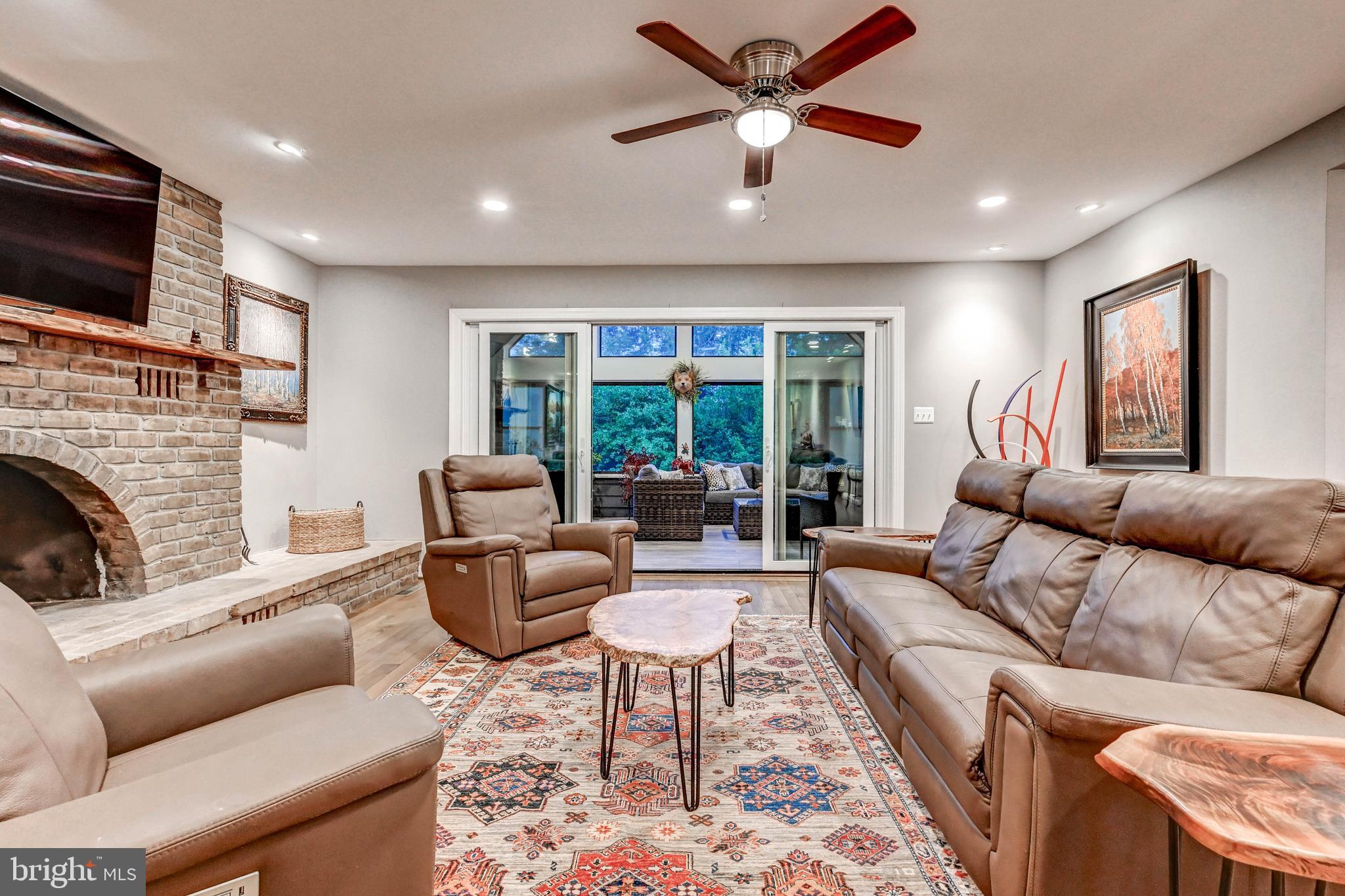 1111 Corbett Road Monkton, MD 21111 - Photo 12 of 33 a living room with furniture fireplace and a flat screen tv