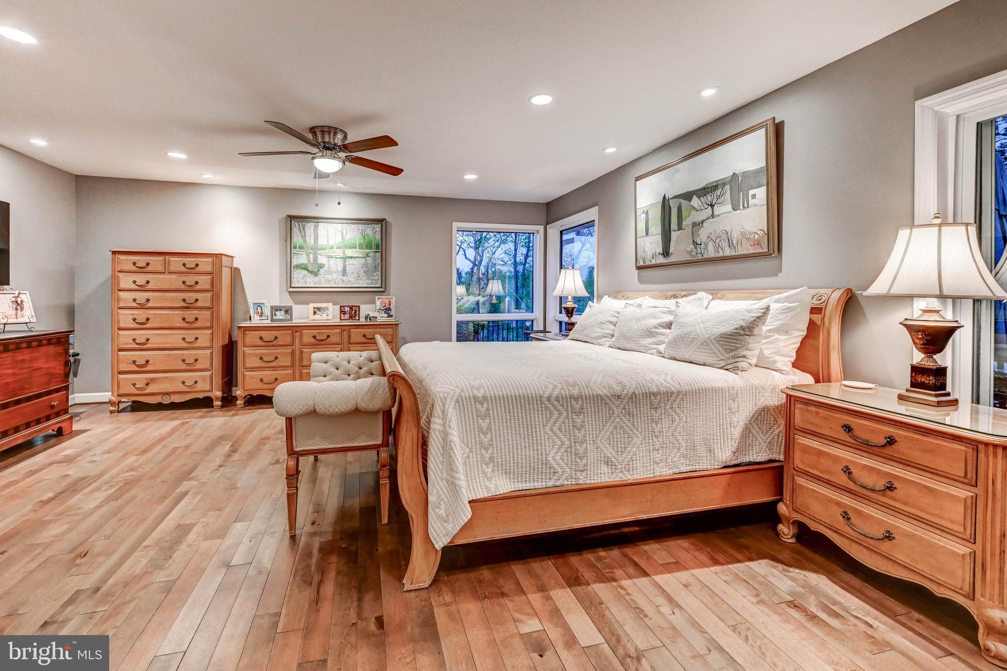 1111 Corbett Road Monkton, MD 21111 - Photo 16 of 33 a bedroom with a bed and wooden floor