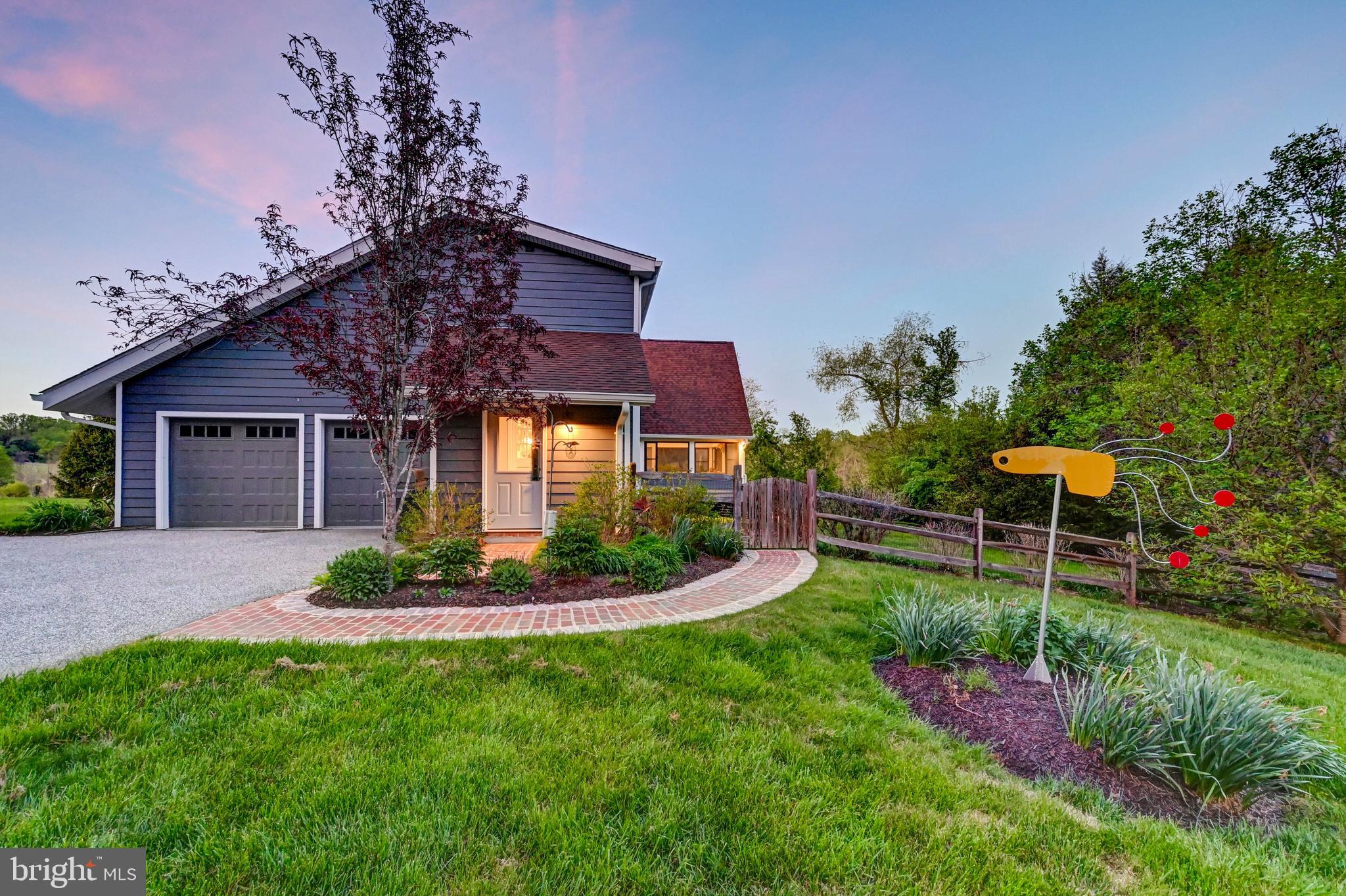 1111 Corbett Road Monkton, MD 21111 - Photo 23 of 33 a front view of a house with a yard table and chairs