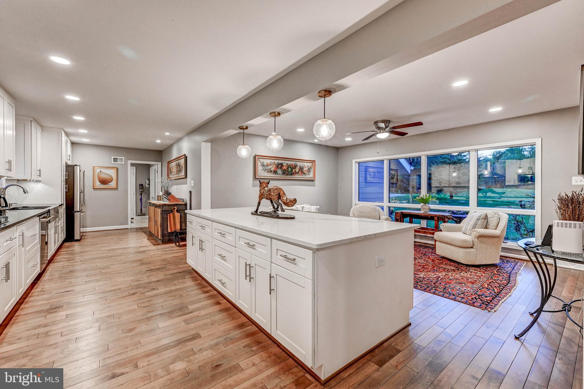 1111 Corbett Road Monkton, MD 21111 - Photo 24 of 33 a large open kitchen with stainless steel appliances granite countertop a large kitchen island and a wooden floors