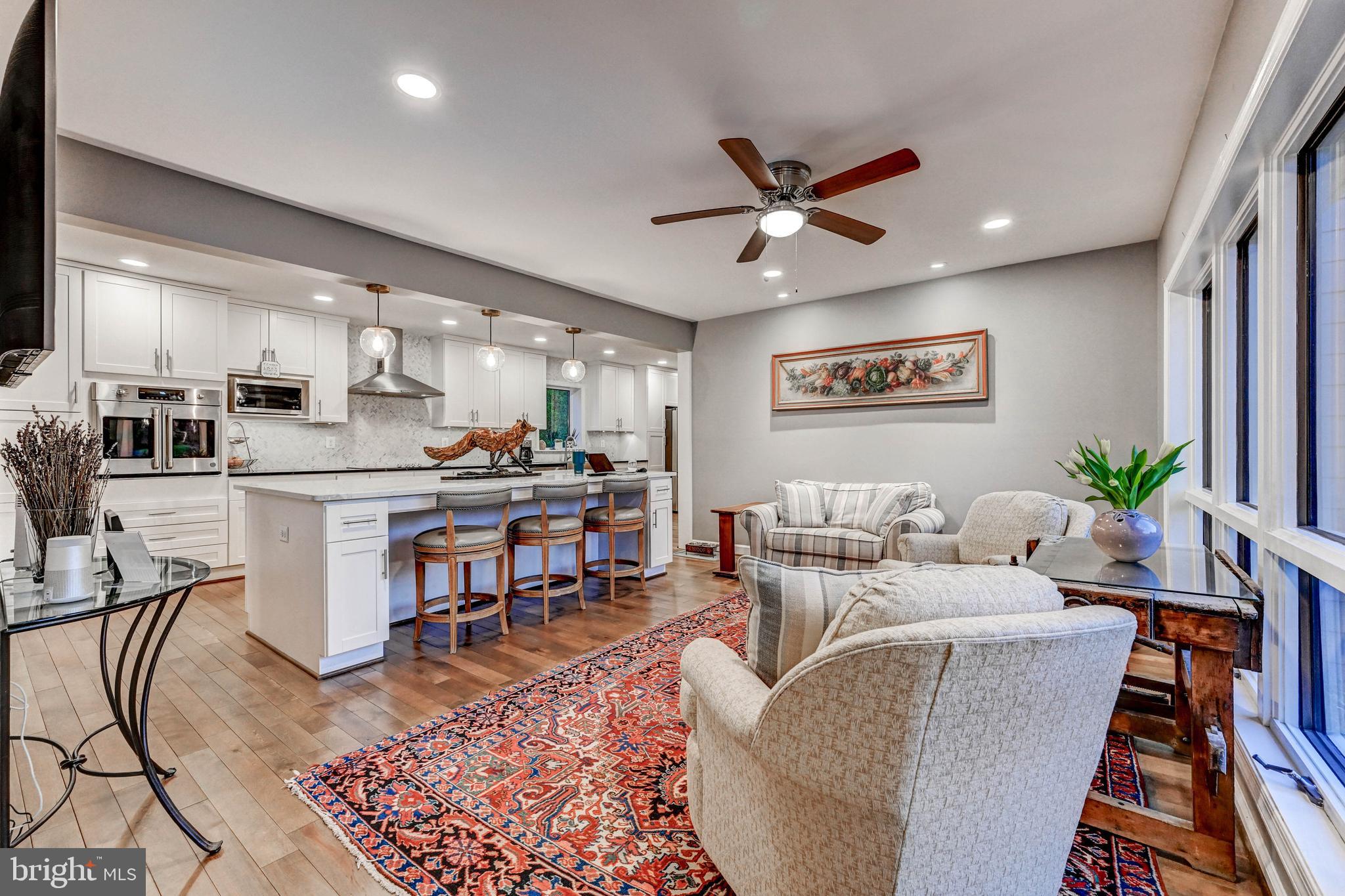 1111 Corbett Road Monkton, MD 21111 - Photo 25 of 33 a living room with furniture kitchen view and a chandelier