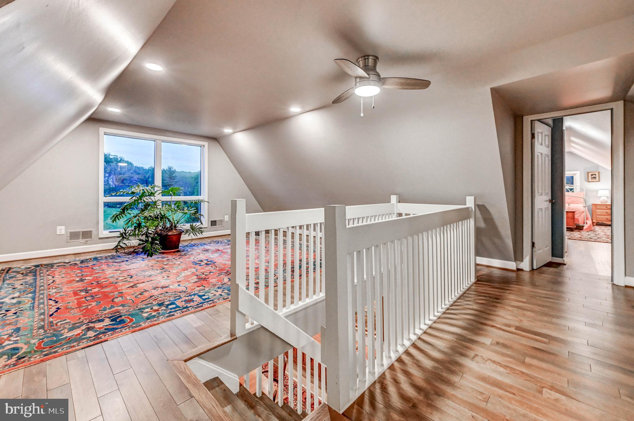 1111 Corbett Road Monkton, MD 21111 - Photo 28 of 33 a view of a hallway view with wooden floor and stairs