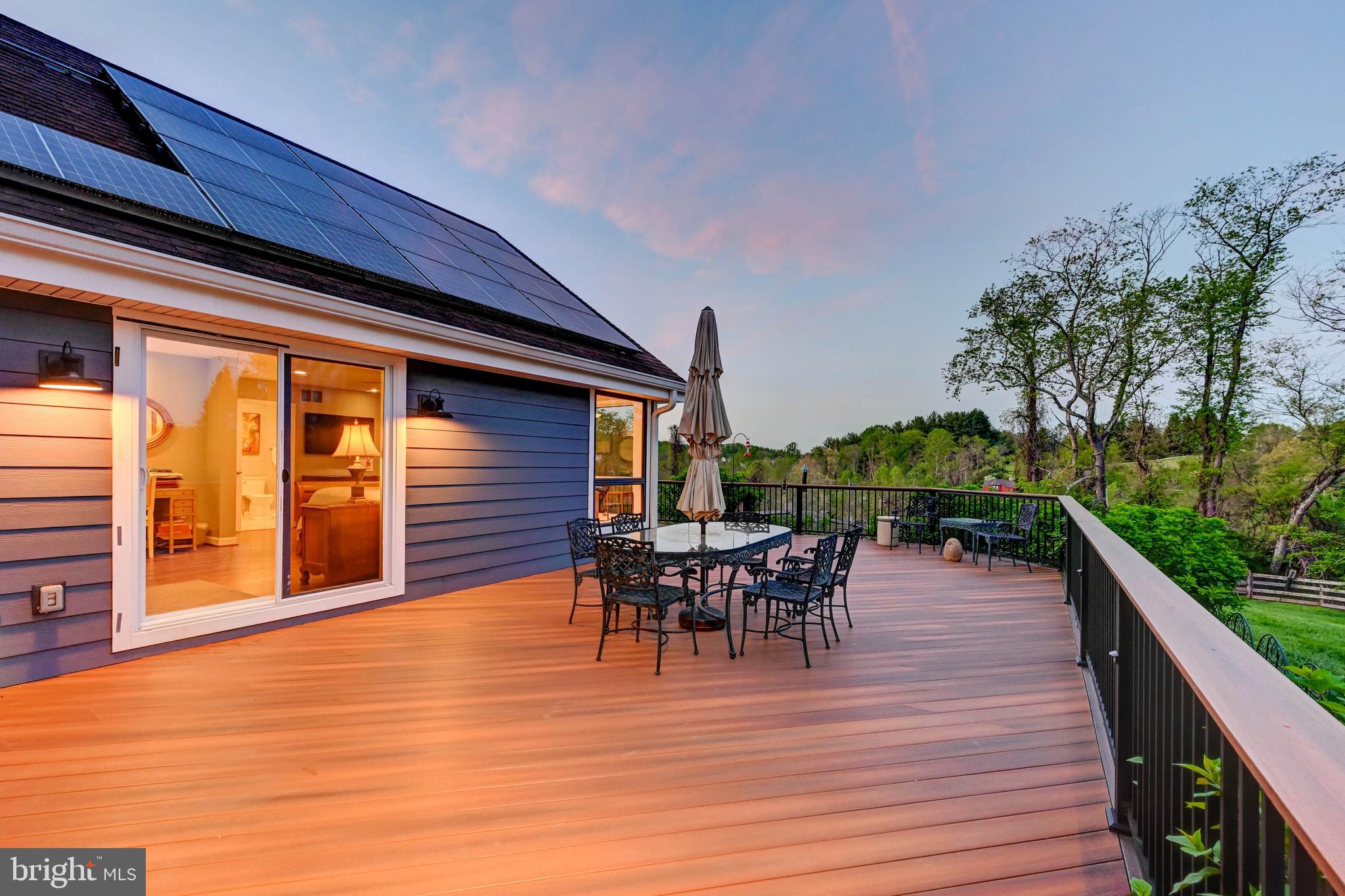 1111 Corbett Road Monkton, MD 21111 - Photo 5 of 33 a view of a roof deck with table and chairs potted plants with wooden floor and fence