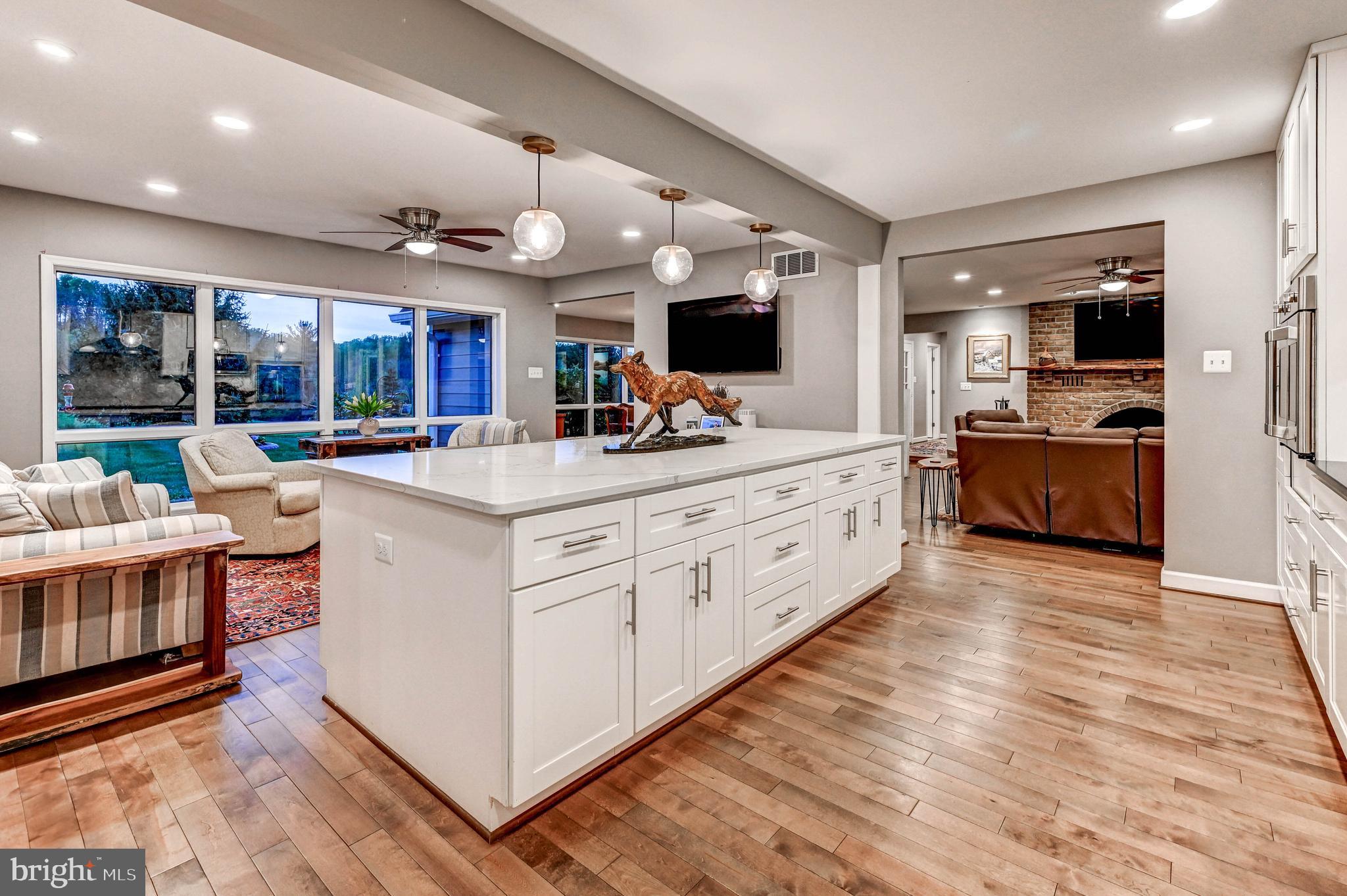 1111 Corbett Road Monkton, MD 21111 - Photo 8 of 33 a large white kitchen with stainless steel appliances kitchen island granite countertop a large counter top and stainless steel appliances