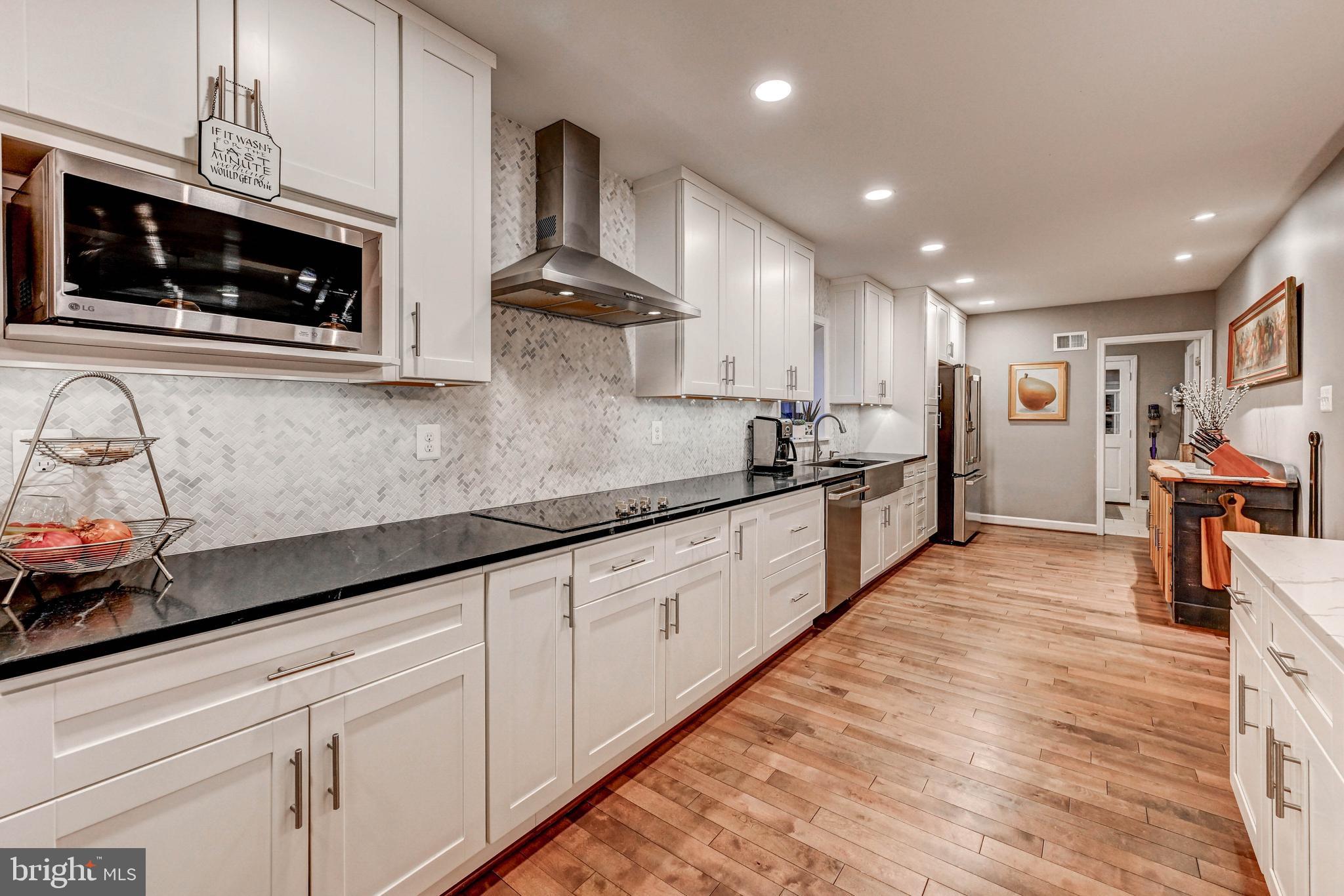 1111 Corbett Road Monkton, MD 21111 - Photo 9 of 33 a kitchen with stainless steel appliances granite countertop a sink and cabinets