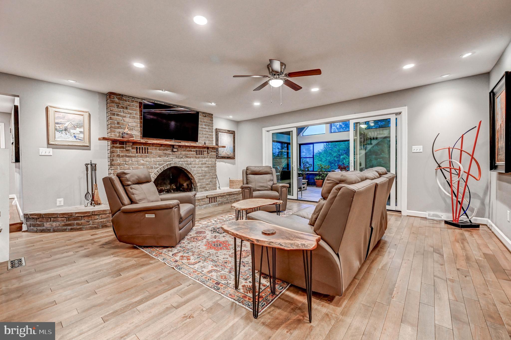 1111 Corbett Road Monkton, MD 21111 - Photo 10 of 33 a living room with furniture a flat screen tv and a fireplace