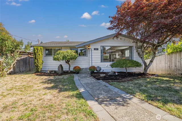 a front view of a house with garden