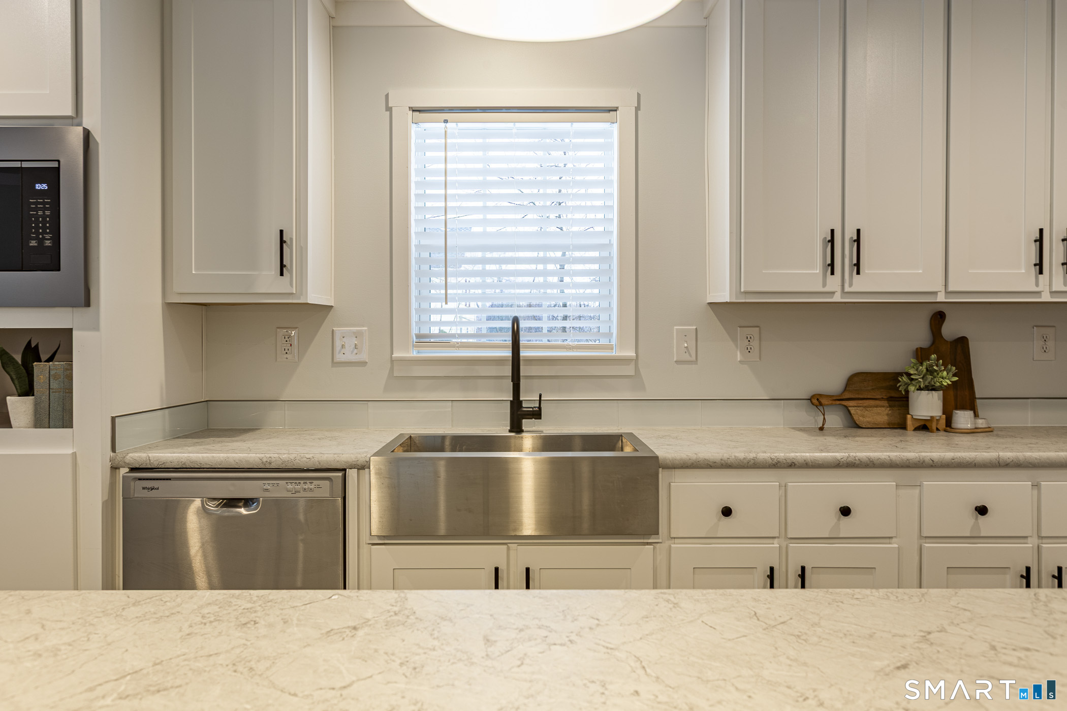 67 Middle Road Enfield, CT 06082 - Photo 13 of 43 a kitchen with granite countertop a sink and cabinets