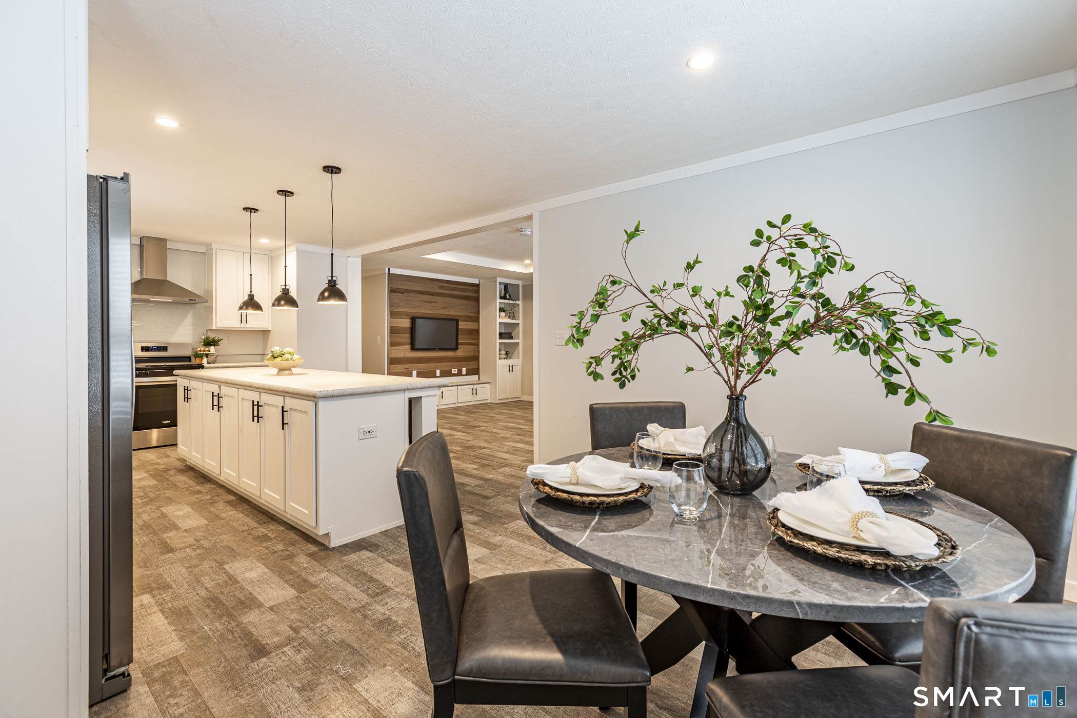 67 Middle Road Enfield, CT 06082 - Photo 14 of 35 a living room with furniture and a kitchen view