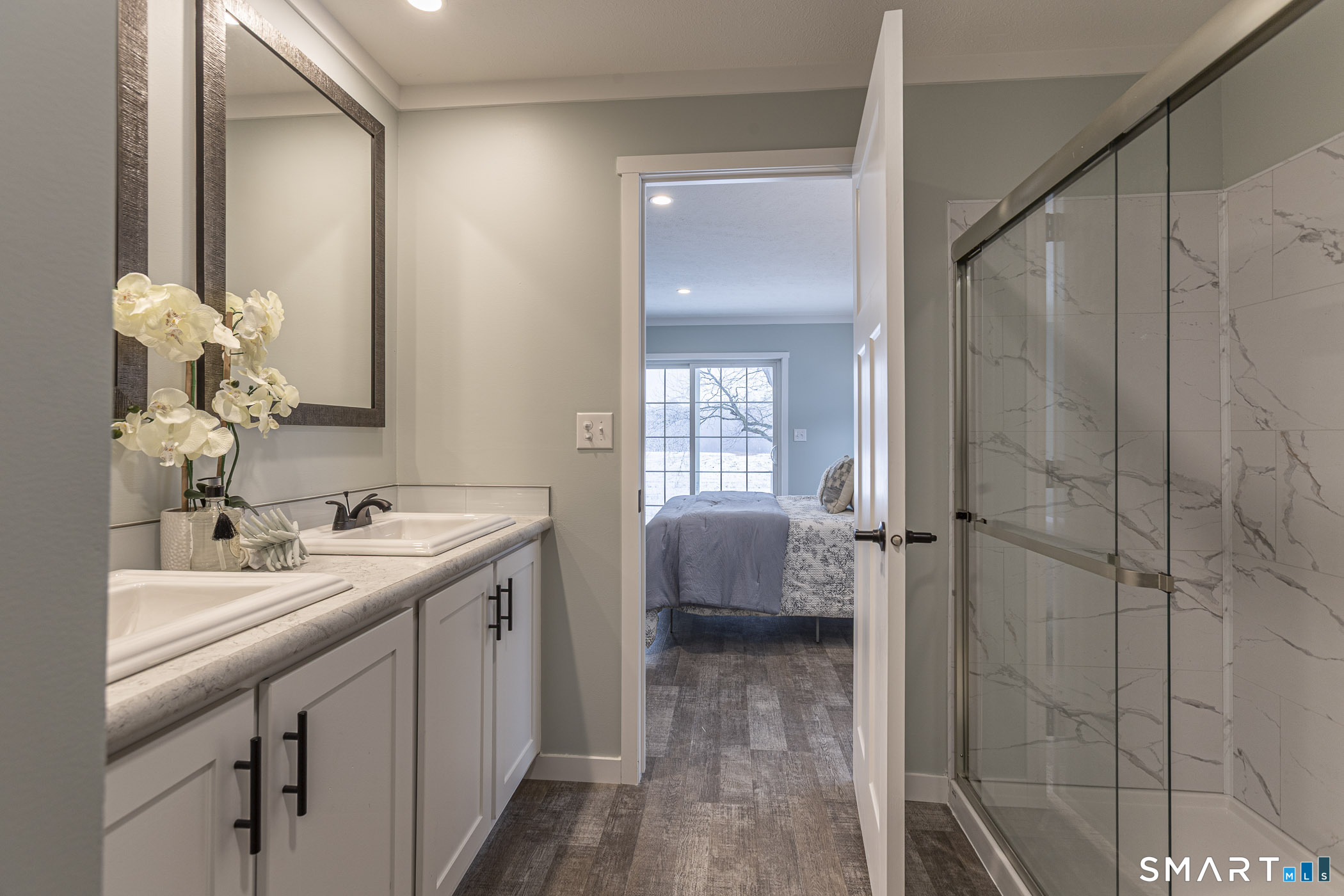 67 Middle Road Enfield, CT 06082 - Photo 20 of 35 a en suite bathroom with a double vanity sink a and mirror