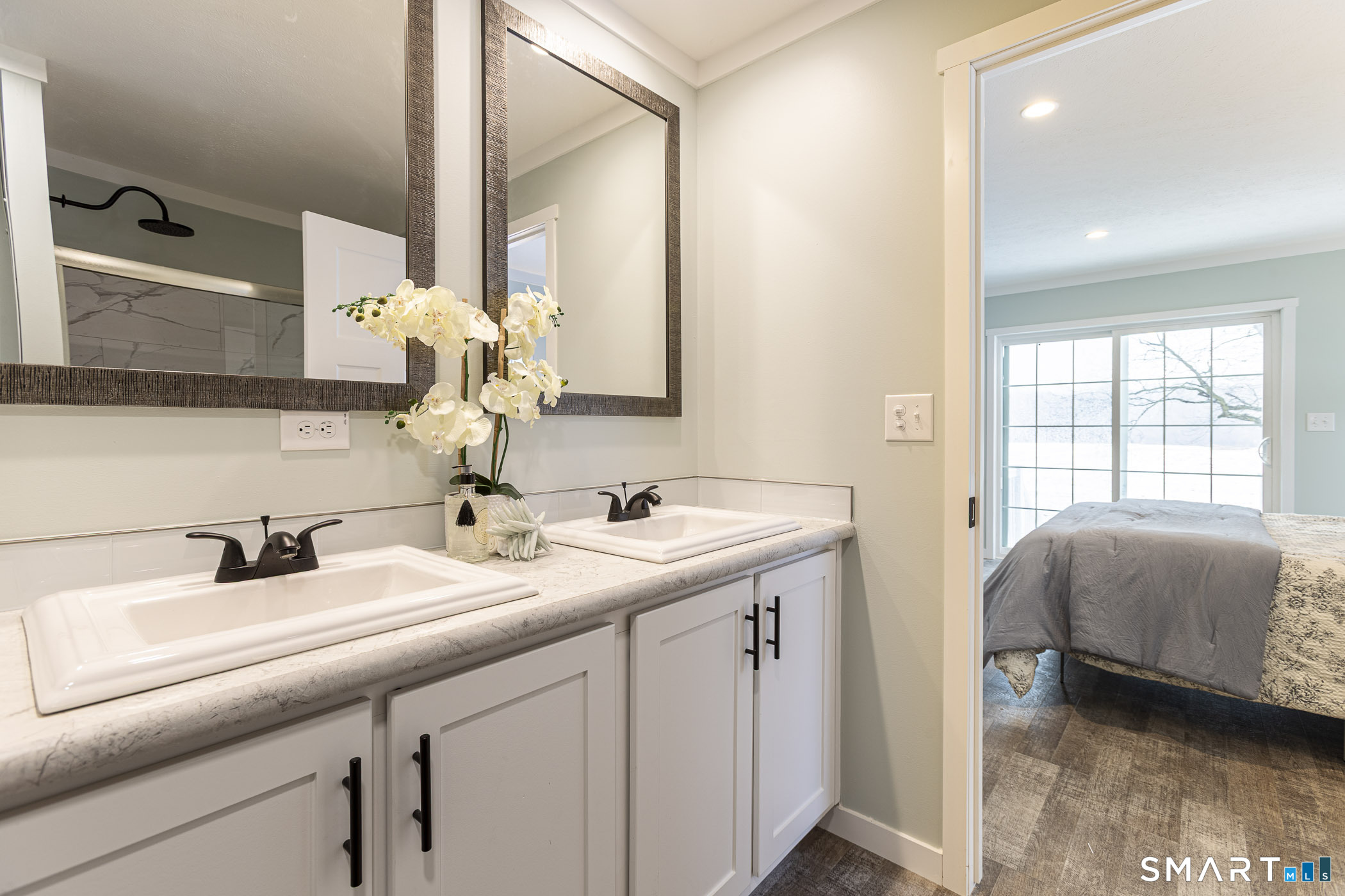 67 Middle Road Enfield, CT 06082 - Photo 22 of 43 a en suite bathroom with a double vanity sink and mirror