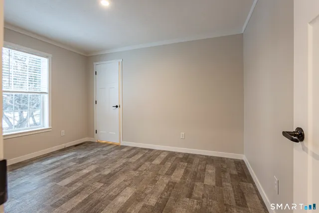 a balcony with table and chairs
